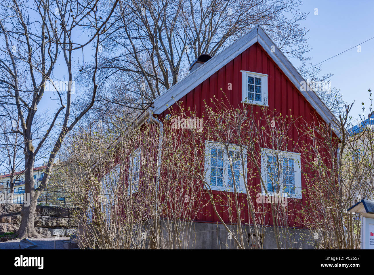 The cottage known as `Hønse-Lovisas hus`, a small red house near the Beier bridge, near  the largest waterfall of the Akerselva River in Oslo, Norway Stock Photo